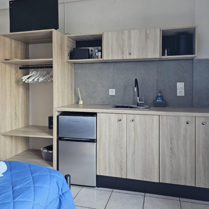 room 19 kitchen with bed 2026